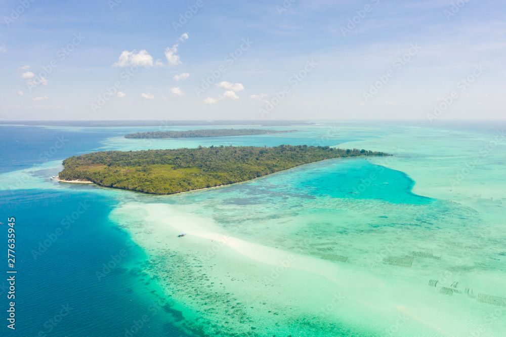 Mansalangan sandbar, Balabac, Palawan, Philippines. Tropical islands with turquoise lagoons, view from above. Seascape with atolls and islands. Mansalangan sandbar, Balabac, Palawan, Philippines. Tropical islands with turquoise lagoons, view from above. Seascape with atolls and islands.