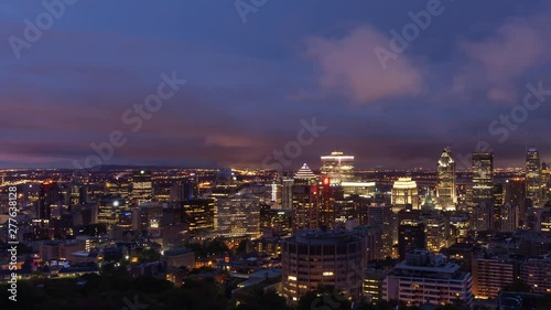 Wallpaper Mural Aerial Time Lapse of a beautiful modern downtown city during a striking cloudy sunrise. Taken in Mt Royal, Montreal, Quebec, Canada. Torontodigital.ca