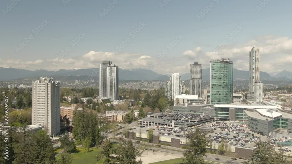 Aerial view of buildings near Surrey Central Mall during a sunny day. Taken in Greater Vancouver, British Columbia, Canada. Aerial view of buildings near Surrey Central Mall during a sunny day. Taken in Greater Vancouver, British Columbia, Canada.