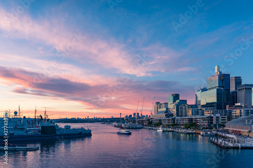 Modern cityscape with business office buildings and harbour at sunset