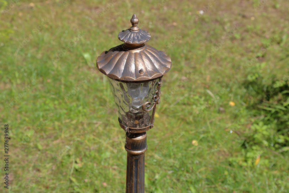 Beautiful vintage brass lantern on a city street