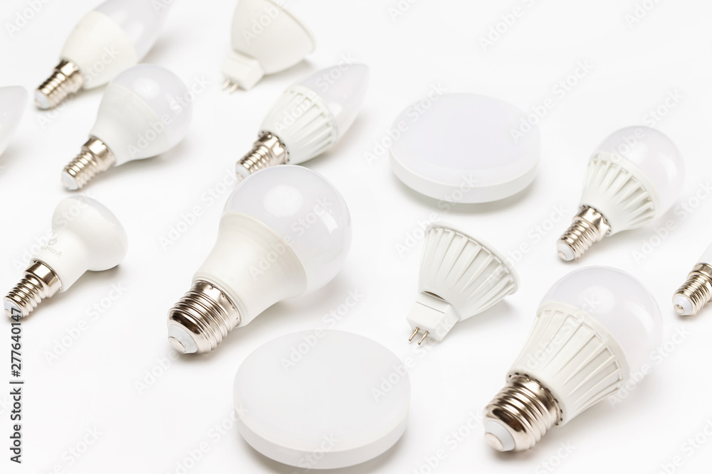 Group of different energy saving lamps isolated at yellow background. Group of different energy saving lamps isolated at yellow background.