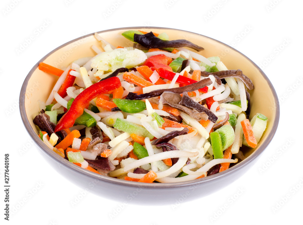 Mix vegetables with chinese mushrooms in bowl on light background