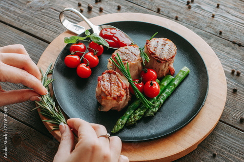 Food styling and restaurant meal serving. Grilled tenderloin medallions with vegetables