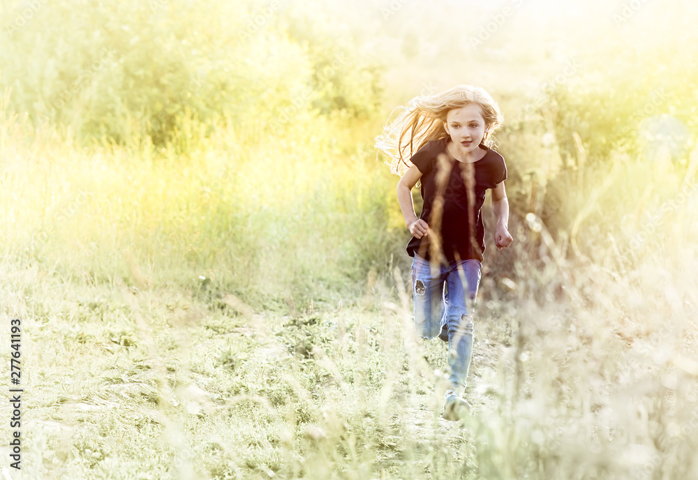 Little girl running on meadow Little girl running on meadow