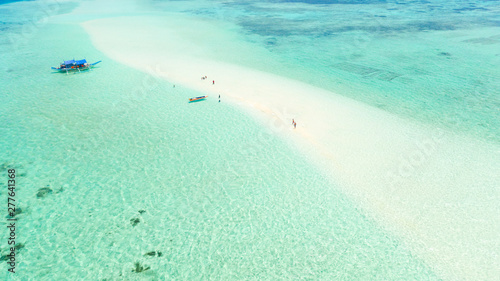 Mansalangan sandbar, Balabac, Palawan, Philippines. Tropical islands with turquoise lagoons, view from above. Boat and tourists in shallow water.