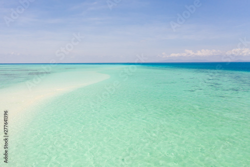 Coral reefs and atolls in the tropical sea  top view. Turquoise sea water and beautiful shallows. Philippine nature.