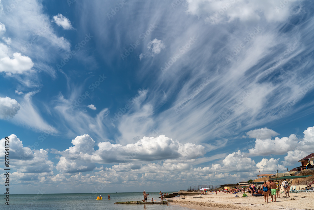 white clouds float in the blue sky white clouds float in the blue sky