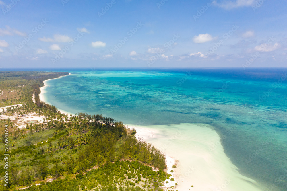 Large tropical island white sandy beach, view from above. Seascape, nature of the Philippine Islands. Tropical forest and sea lagoons.