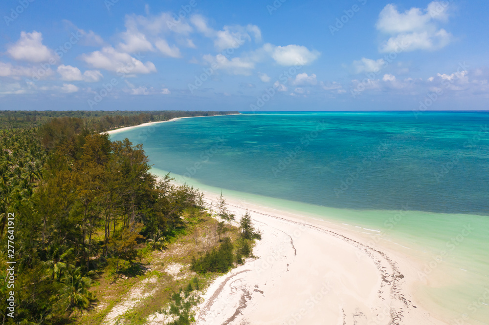 Large tropical island white sandy beach, view from above. Seascape, nature of the Philippine Islands. Tropical forest and sea lagoons.