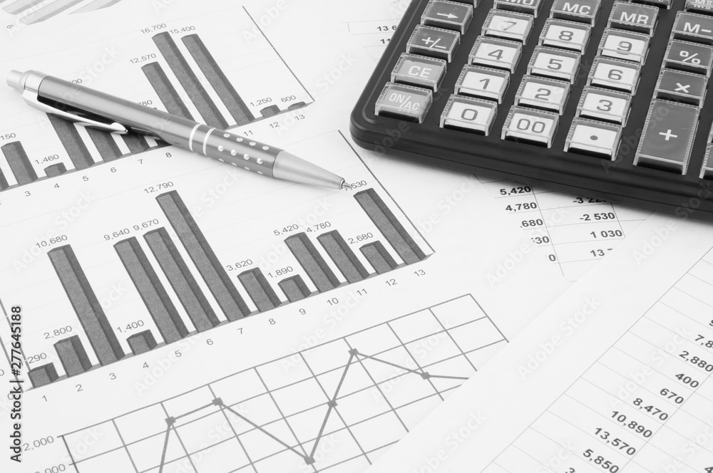 Business concept with pen, calculator and documents Business concept with pen, calculator and documents