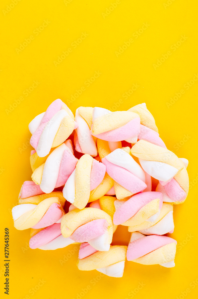 Colorful marshmallow on bright  background. Fluffy marshmallows texture and pattern