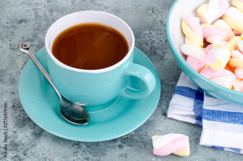Hot chocolate in blue cup with marshmallows Hot chocolate in blue cup with marshmallows