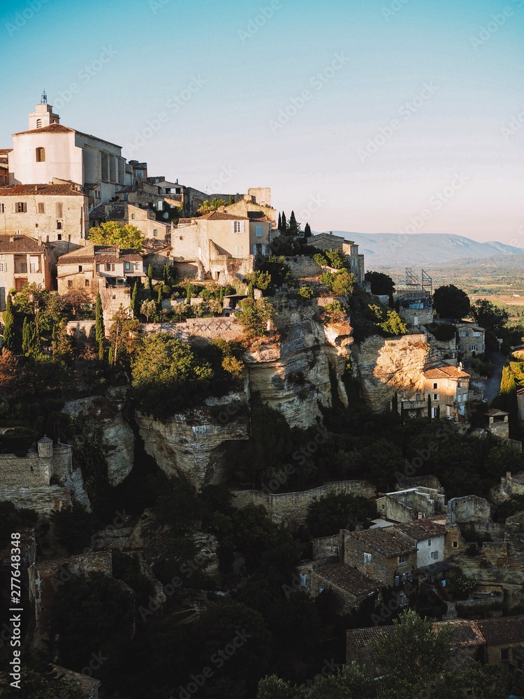 Panorama of the city of Gordes in the sunset in Provence in France