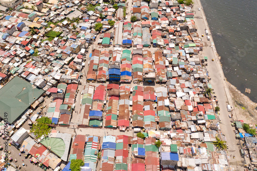 Streets of poor areas in Manila. The roofs of houses and the life of people in the big city. Poor districts of Manila, view from above. Manila, the capital of the Philippines.