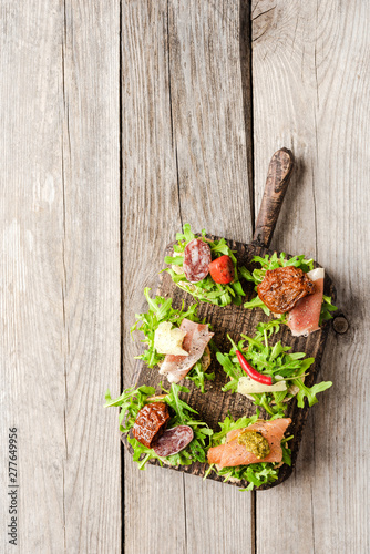 Italian brushetta on wooden table. Food background