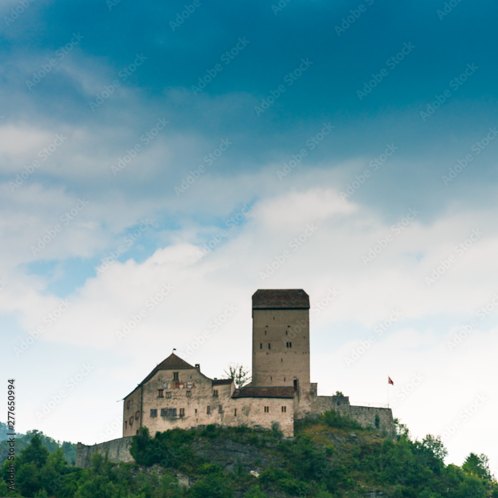 the historic medieval castle at Sargans in the southeastern Swiss Alps on its grassy hilltop promontory