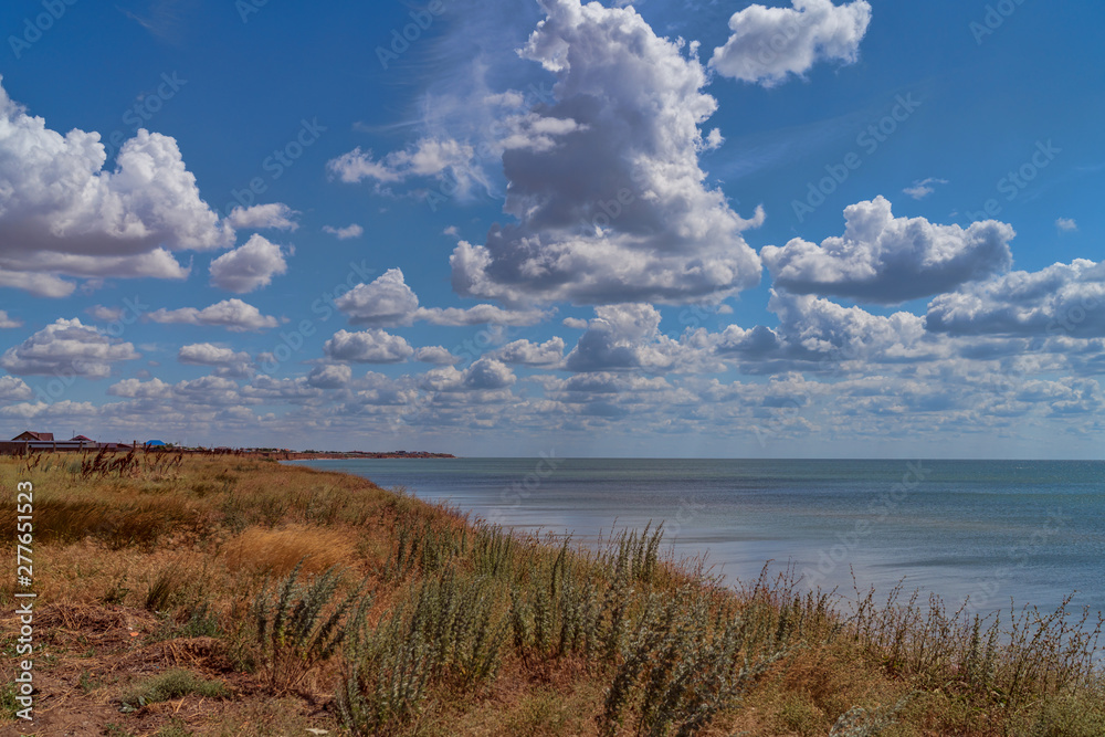 the coast of the Sea of Azov, the clouds float in the sky