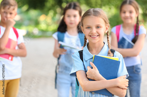 Cute little schoolgirl with...