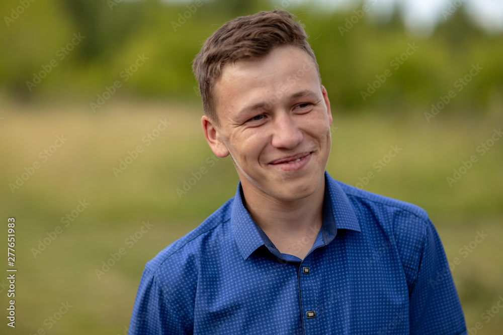 the guy in the blue shirt outdoors on a summer day the guy in the blue shirt outdoors on a summer day