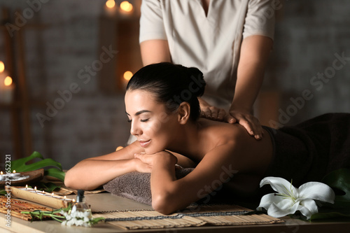 Fotografie, Tablou Beautiful young woman receiving massage in spa salon