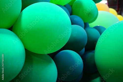 Colorful green and multicolor balloons at a party