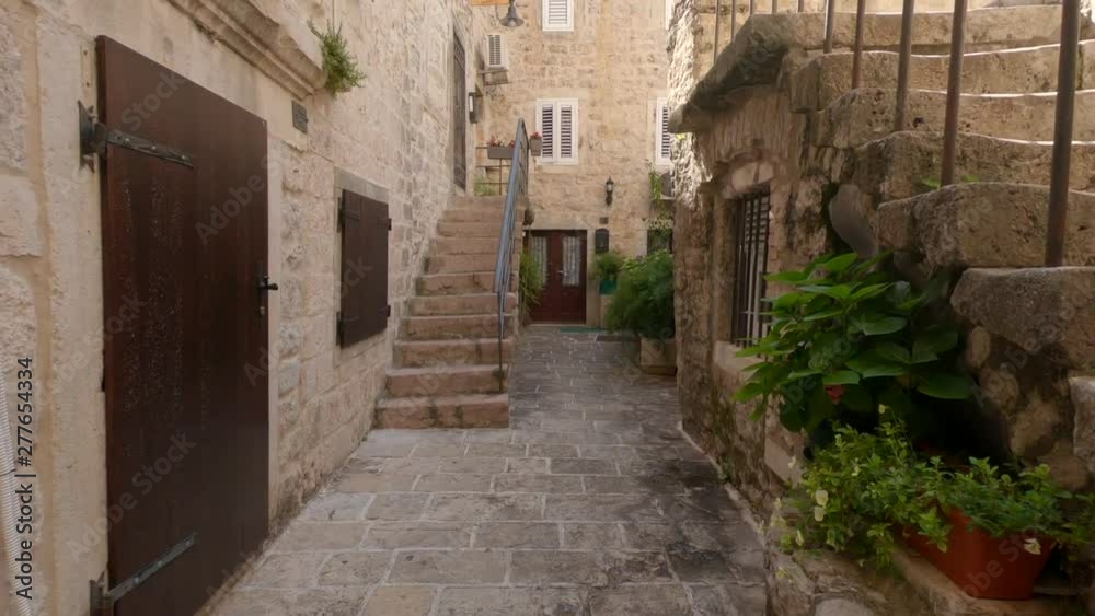 Ancient houses and narrow streets in old town of Budva, Montenegro. Ancient houses and narrow streets in old town of Budva, Montenegro.