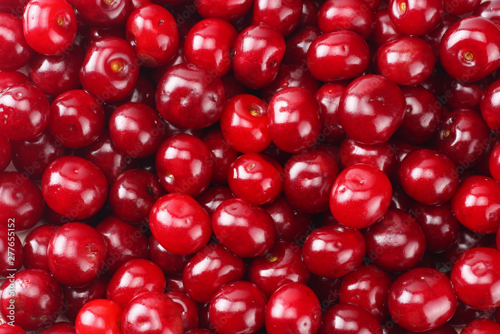 Red juicy cherries background. cherry texture. Top view. Red juicy cherries background. cherry texture. Top view.
