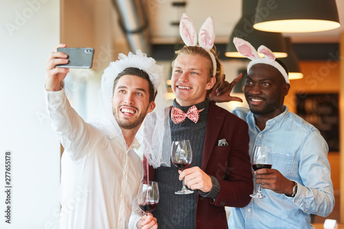 Friends make selfie at bachelor party photo