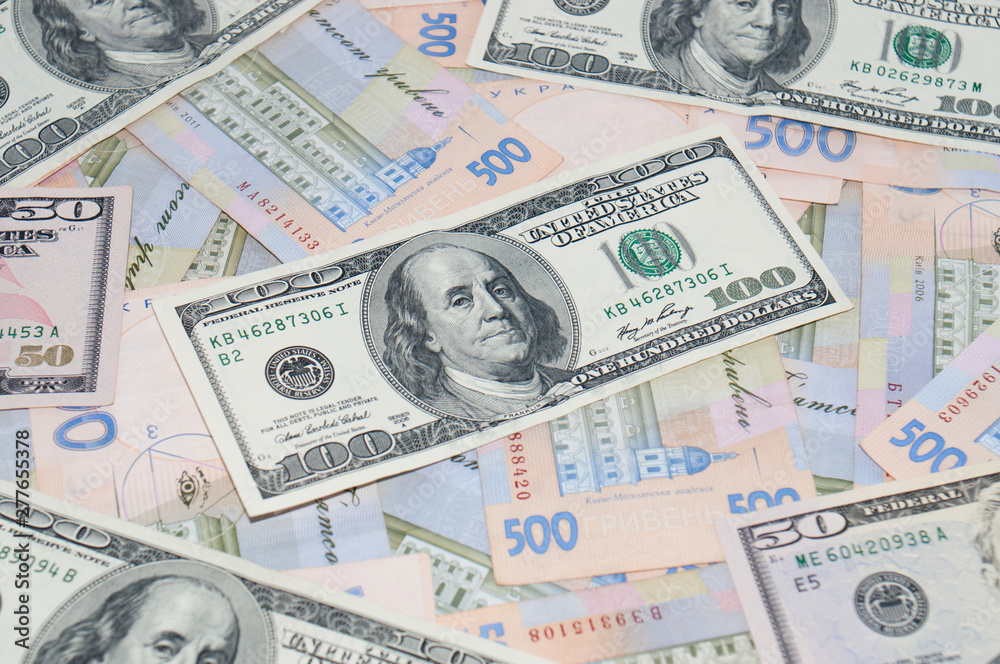 Money, dollars and hryvnia, close-up, top view. The concept of the dollar and the hryvnia, finance, banks. Money, dollars and hryvnia, close-up, top view. The concept of the dollar and the hryvnia, finance, banks.