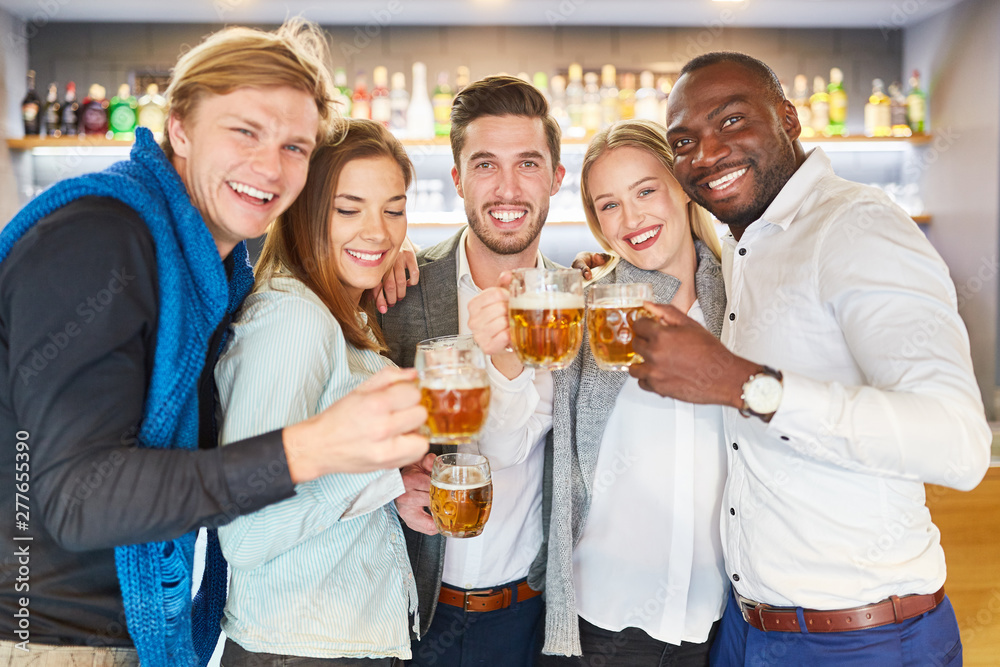 Group of multicultural friends having beer while drinking Group of multicultural friends having beer while drinking