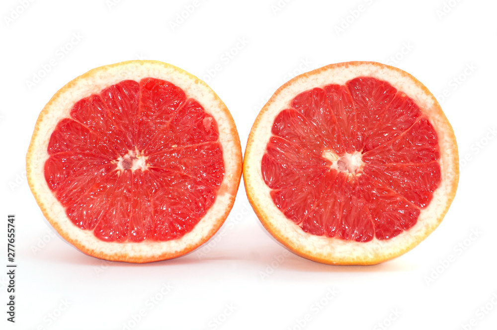 Slices of grapefruit macro closeup on white background Slices of grapefruit macro closeup on white background