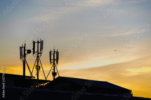 Silhouette cellular antennas at sunrise