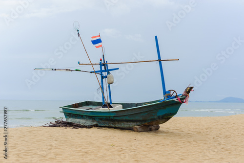 Fishing boat on a beach at ebb tide