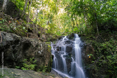 Ton Sai Waterfall in the tropical forest area In Asia, suitable for walks, nature walks and hiking, adventure photography Of the national park Phuket Thailand.