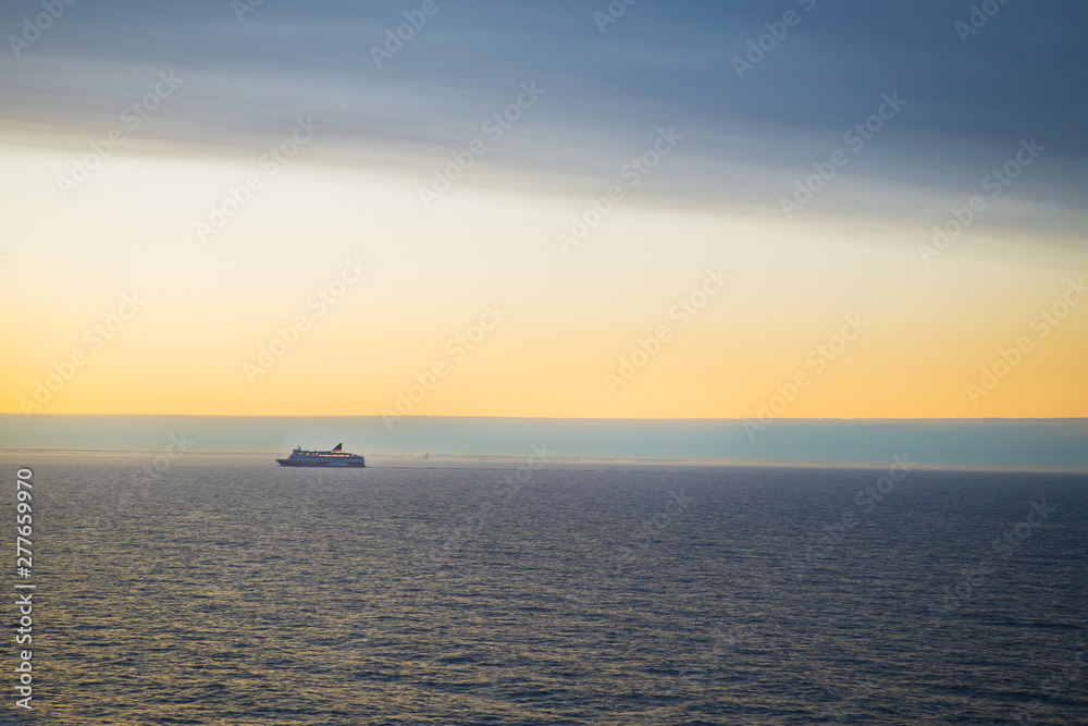 The ferry sails at dawn. Very beautiful sky. The ferry sails at dawn. Very beautiful sky.
