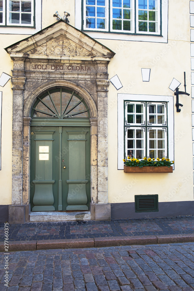 Very beautiful green old doors in the old city of Riga in Latvia.