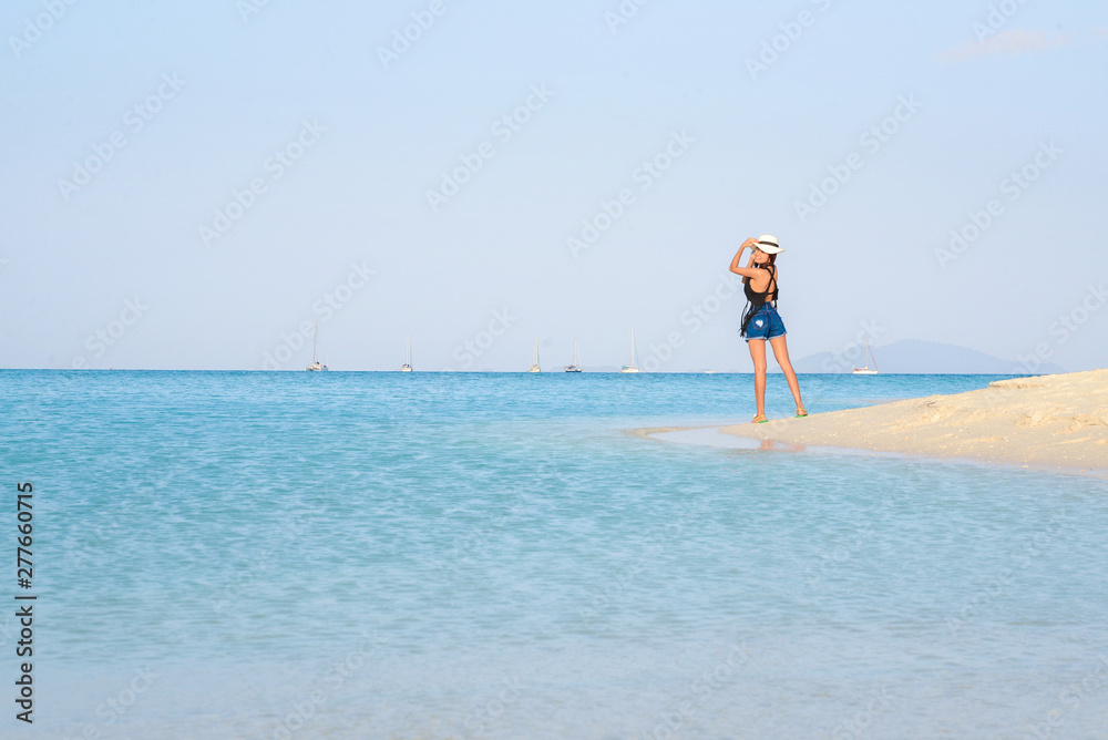 Portrait of young pretty woman at the turquoise sea beach, Lipe island, Thailand Portrait of young pretty woman at the turquoise sea beach, Lipe island, Thailand