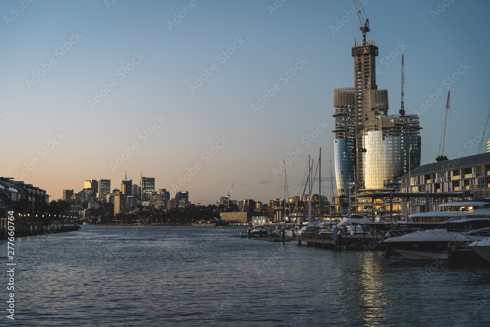Pyrmont, New South Wales - JUNE 28th, 2019: Progress image of the new Star Casino being built at Barangaroo, Sydney. Shot just after sunset at dusk.