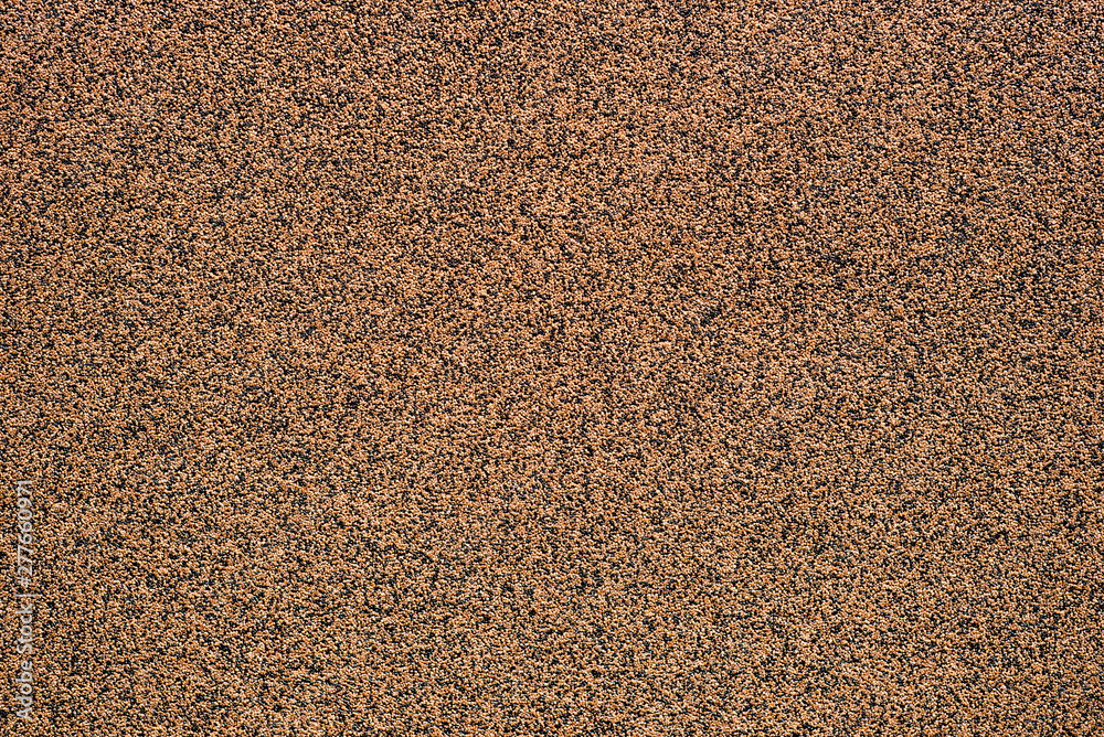 Brown concrete texture with small pebbles Brown concrete texture with small pebbles
