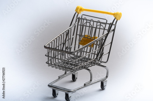 Close-up of shopping carts on white background.Trolley, Sale concept.Empty grocery shopping cart. Isolated over white background.