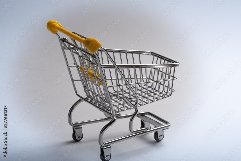Close-up of shopping carts on white background.Trolley, Sale concept.Empty grocery shopping cart. Isolated over white background. Close-up of shopping carts on white background.Trolley, Sale concept.Empty grocery shopping cart. Isolated over white background.