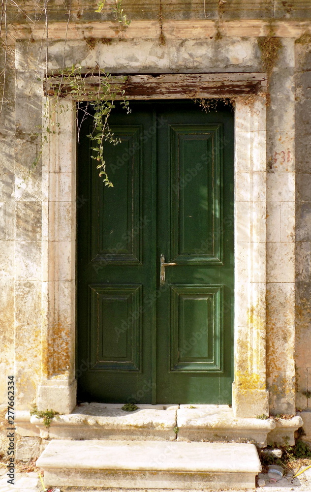 old wooden door in a Greek village