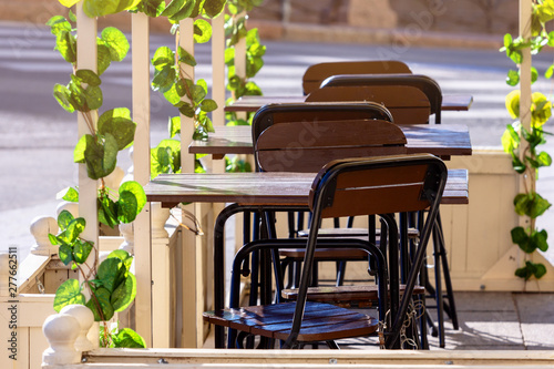 Fototapeta Naklejka Na Ścianę i Meble -  empty summer cafe restaurant early sunny morning