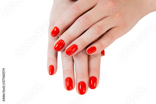 Obraz na plátně Female hands with red nails, isolated on white.