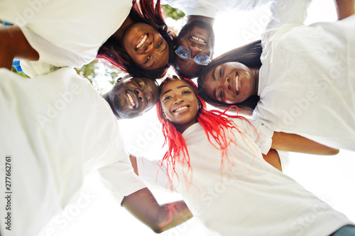 Принти на полотні Group of happy african volunteers hugs in park