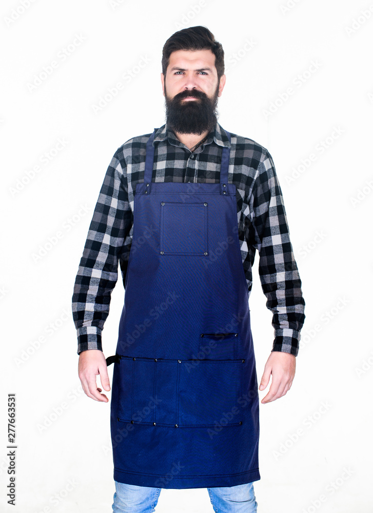 Apron protecting his clothing from splatters. Master cook in cooking apron with pockets. Bearded man cook in kitchen apron. Grill cook isolated on white. Cook with long beard wearing bib apron Apron protecting his clothing from splatters. Master cook in cooking apron with pockets. Bearded man cook in kitchen apron. Grill cook isolated on white. Cook with long beard wearing bib apron