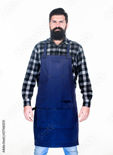 Apron protecting his clothing from splatters. Master cook in cooking apron with pockets. Bearded man cook in kitchen apron. Grill cook isolated on white. Cook with long beard wearing bib apron © be free