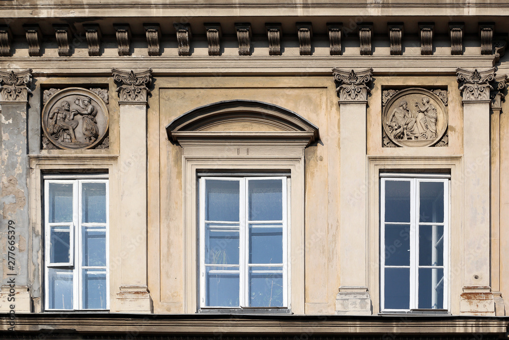 Window decoration of buildings of Krakow suburb street.