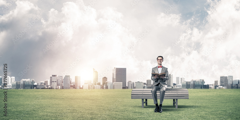 Young businessman or student studying the science and cityscape at background Young businessman or student studying the science and cityscape at background
